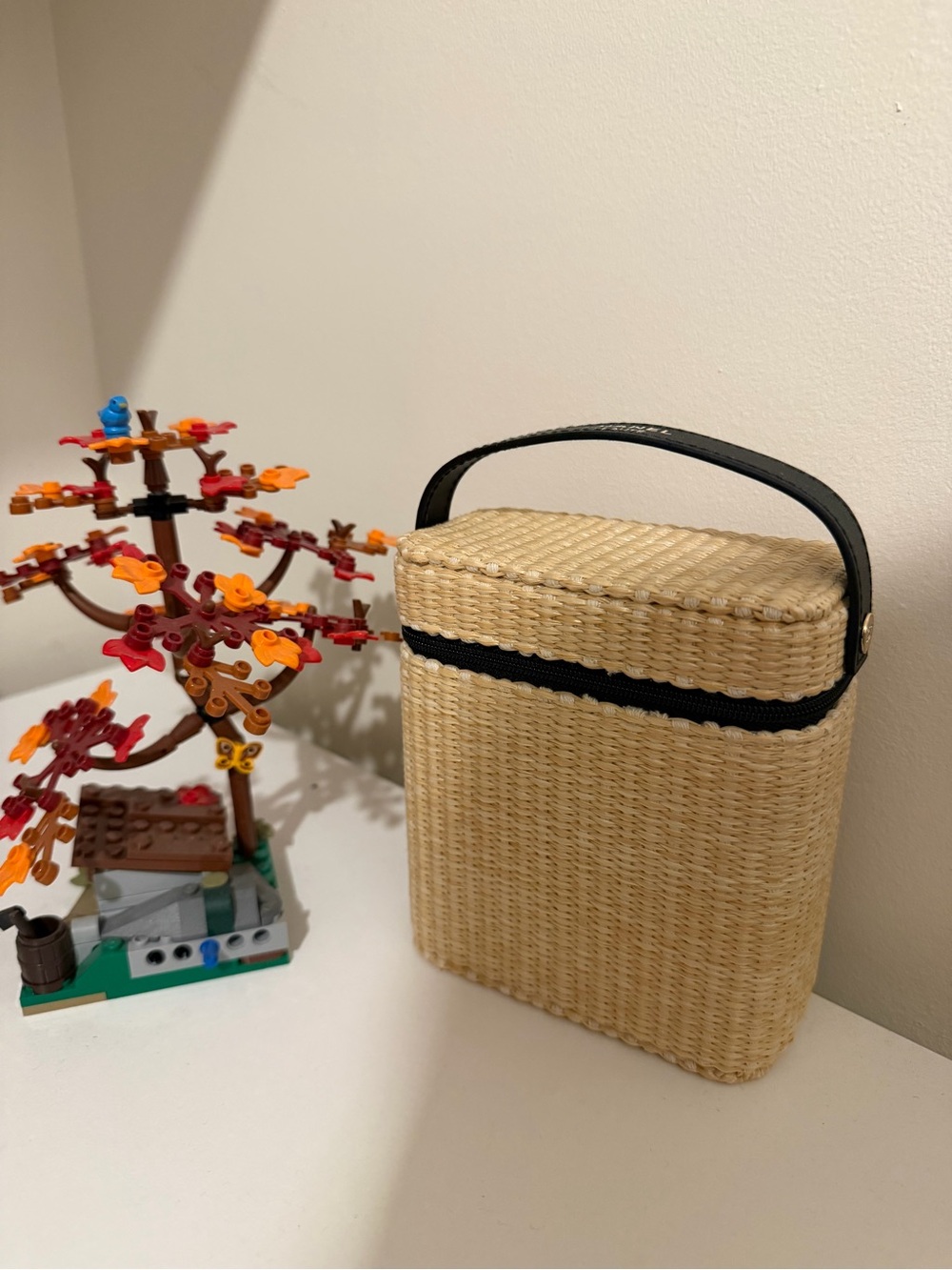 Woven Straw Storage Basket with Black Handle and Trim